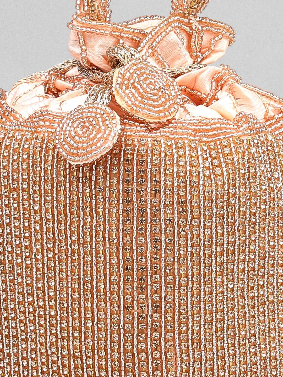 Rubans Peach Coloured Potli Bag With Golden Embroided Design.